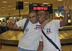 Two students celebrate their arrival at the Salt Lake airport