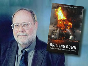 USU professor Joseph Tainter with his book
