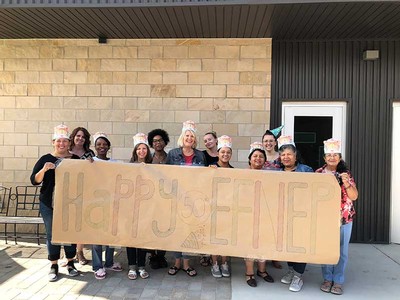 USU EFNEP staff celebrating with a banner