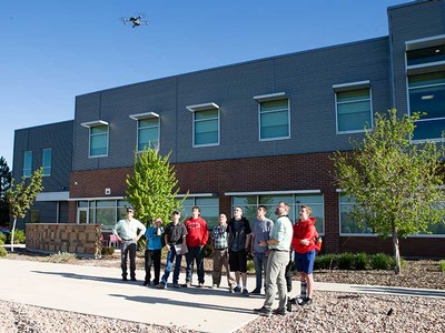 students flying drone