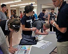 Aggies Elevated students getting student ID card