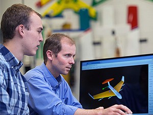 Engineering professor Doug Hunsaker and a student at a computer
