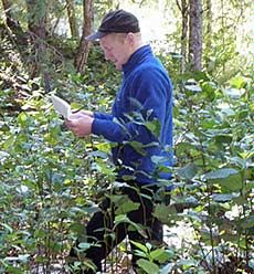 USU doctoral student Nate Hough-Snee doing fieldwork at a research site