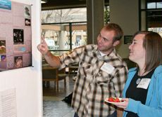 Devin Christensen and Erin Fleming describe their poster, ‘Fish Foreplay.’ 