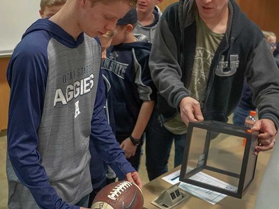 Tanner Barnes with an Aggie game ball