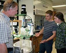 USU professor Lance Seefeldt and grad students and Alan Weber