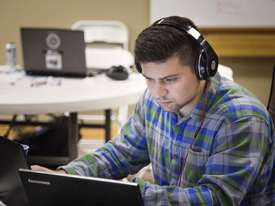 student listening to headphones