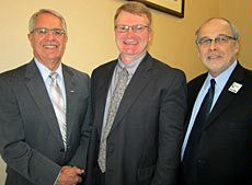 USU President Stan Albrecht, professor Kevin Heaton, Provost Raymond T. Coward