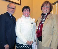 USU professor Flora Shrode, Provost Raymond Coward and Joyece Albrecht