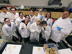 Lianna Etchberger and students in a lab