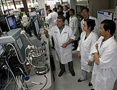 visiting scientists in USU lab