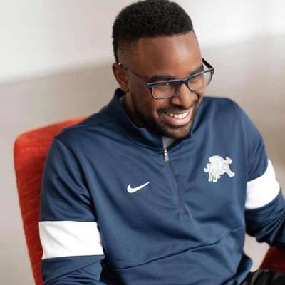 Isaiah Jones sits in a chair.