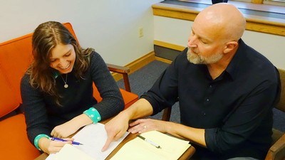 John Seiter with a student.