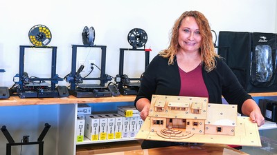 USU Eastern Lecturer, Kimberly Horsley holds a small model of house