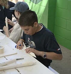 Students made paper rockets during Physics Day activities
