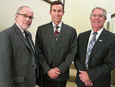 USU Provost Raymond Coward, professor Eadric Bressel, USU President Albrecht