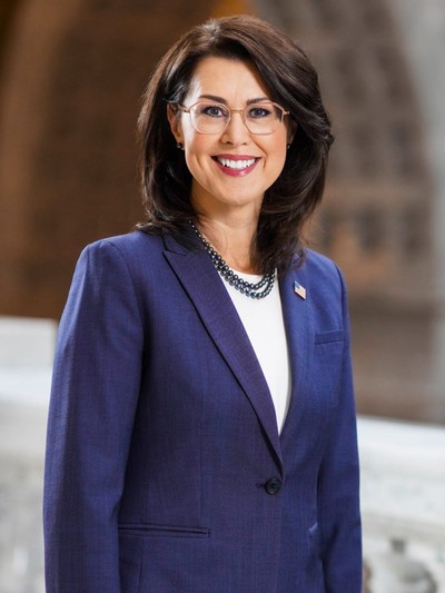 A woman poses for a headshot.