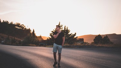 Man walking on a road.