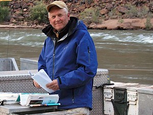 USU professor and researcher Jack Schmidt doing fieldwork research on a river