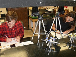 USU undergrad researcher Livi Wilkes and doctoral student Madeleine Dupuy in a USU lab