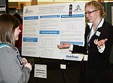 USU undergrad Morgan Summers at poster presentation