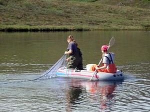USU student reseachers in a raft