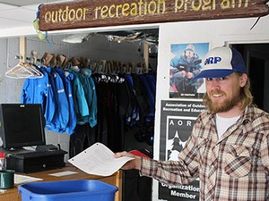 Brad Thompson, USU Outdoor Recreation Program employee recycling