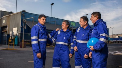 Workers wearing protective clothing.