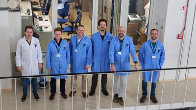 Scientists gather to pose for a photograph