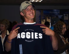 A student with an Aggie T-shirt