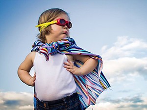 child dressed up as a superhero