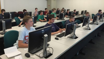 students studying in a computer lab.