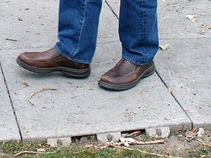 a close-up view of a recycled sidewalk tile in use