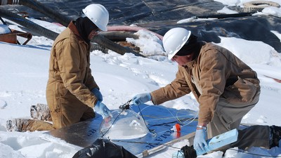 Seth Lyman with a colleague in the field.