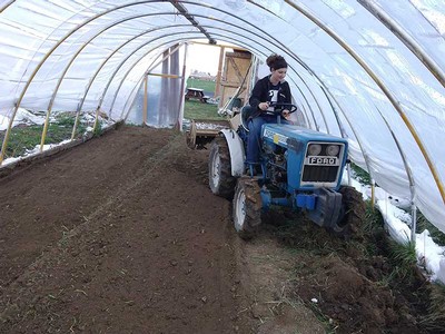 Sierra Zardrus prepares the beds for planting
