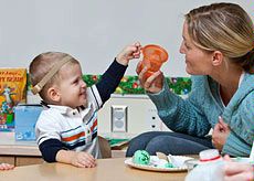Teacher with hearing impaired child