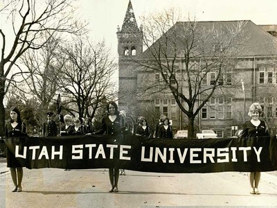 USU ROTC Sponsor Corp marching in front of Old Main.
