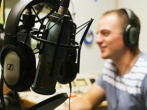 a student in an Aggie radio broadcast