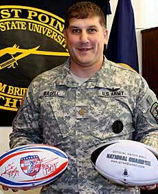 Maj. Matthew Badell with rugby memoribilia
