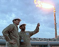 men observing a liquified natural gas plan in Qatar