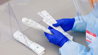 Stack of COVID-19 swab tests.