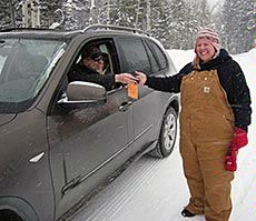 USU student collects a GPS transmitter for Teton National Park visitor