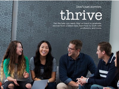 students gathered on a sofa