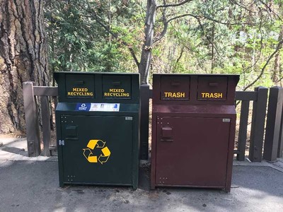 trash and recycle bins in the forest