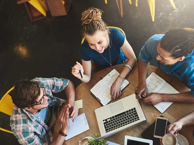 students gathered around a table
