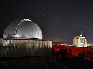 a nightime view of the USU Observatory and the business building