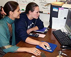USU doctoral student Alina Sergeeva working with a high school student