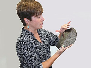 USU geologist Alexis Ault with hematite fault sample