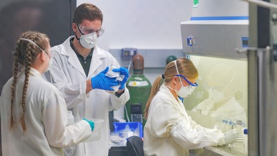 USU student researchers analyze the wastewater samples in a lab.