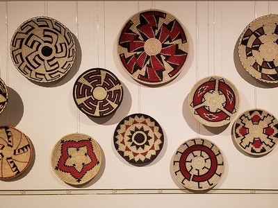 a wall of woven baskets